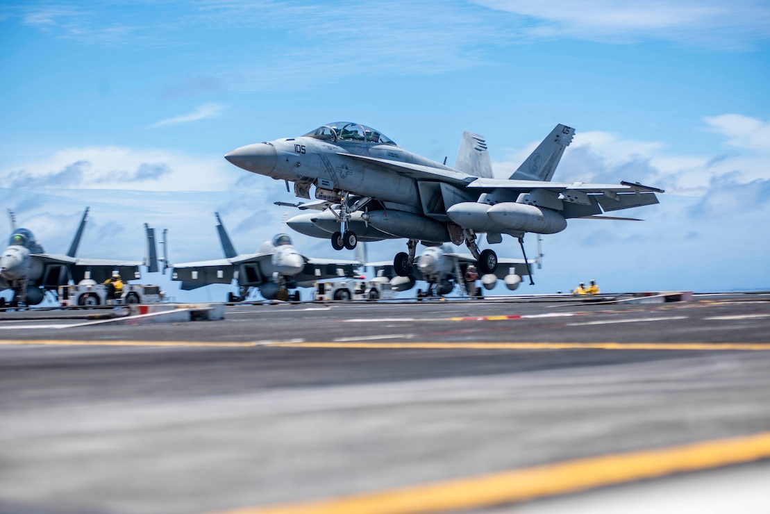 An F/A-18F Super Hornet attached to the Diamondbacks of Strike Fighter Squadron (VFA) 102 lands on the flight deck of the aircraft carrier, USS Ronald Reagan (CVN 76).