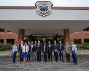 Gen. Jacqueline Van Ovost, Air Mobility Command commander, far left, and Chief Master Sgt. Brian Kruzelnick, AMC command chief, far right, gather with former AMC senior leaders at Scott Air Force Base, Illinois, May 27, 2021. For the first time, former commanders and command chiefs met to formally collaborate on efforts concerning the Mobility Air Forces during the Mobility Statesmen symposium.