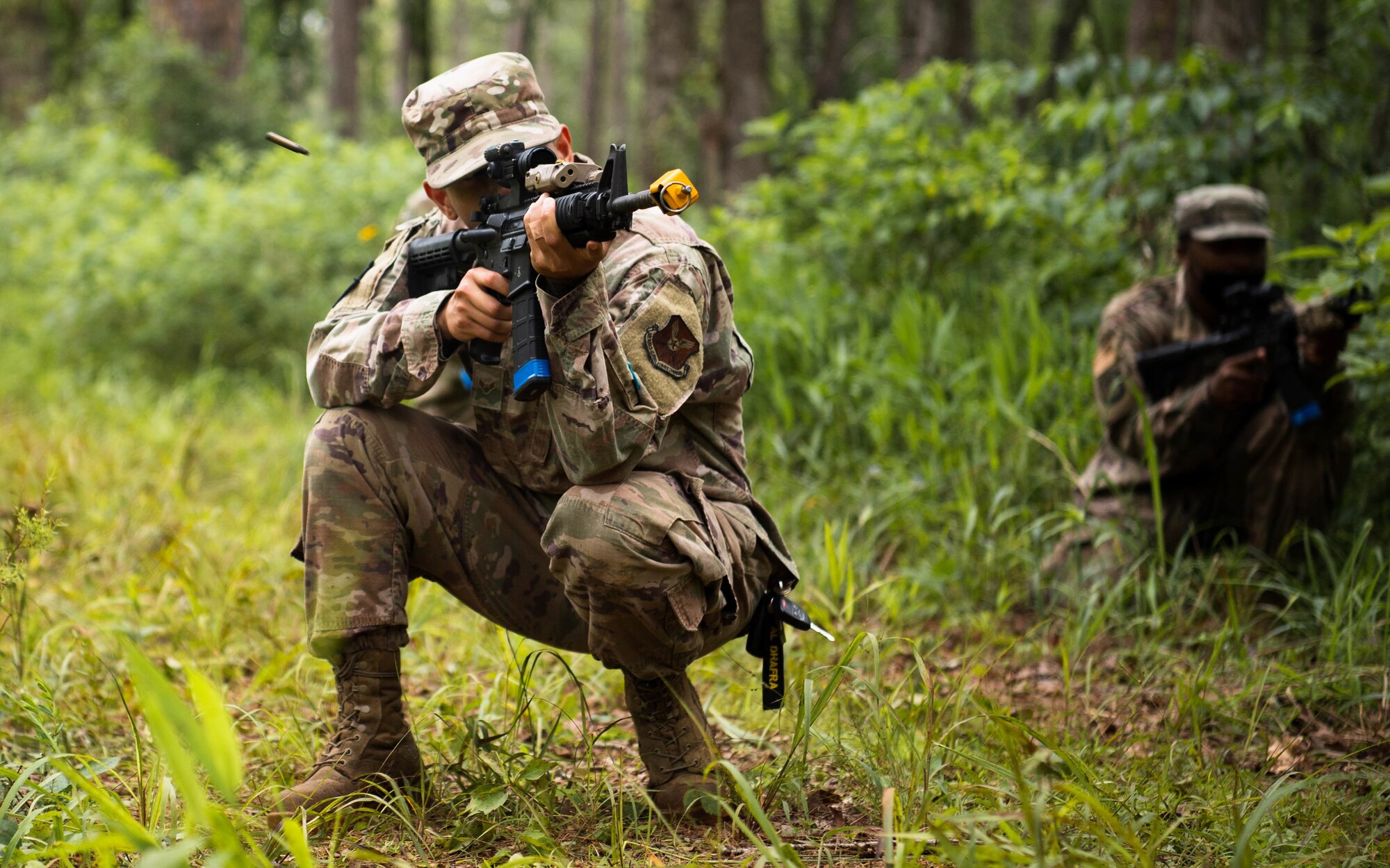 Master Sgt. Perry Link, 2nd Civil Engineer Squadron engineering flight superintendent, fires an M4 rifle during an individual movement techniques and unidentified explosive ordnance portion of a training exercise at Barksdale Air Force Base, Louisiana, May 20, 2021. Training operational skills such as land navigation, weapons assembly and individual movement techniques, the 2nd CES intensified the readiness of it’s engineers, allowing the unit to better adapt to changes in the national security environment and compete in the dynamic future of warfighting. (U.S. Air Force photo by Senior Airman Jacob B. Wrightsman)