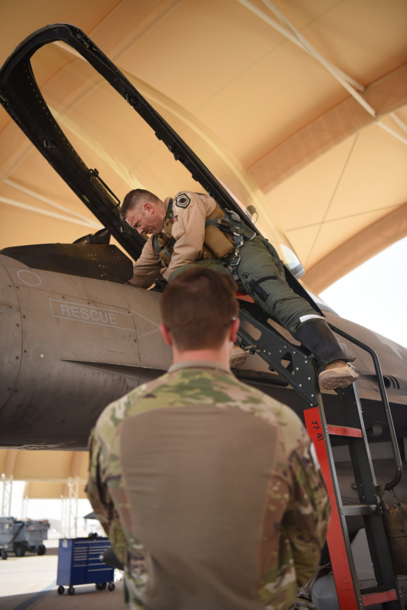 Col. Kristoffer Smith, 378th Expeditionary Operations Group commander, prepares for a flight aboard an F-16 Fighting Falcon fighter jet for takeoff at Prince Sultan Air Base, Kingdom of Saudi Arabia, May 16, 2021. The "Swamp Fox" Airmen from the South Carolina Air National Guard deployed to PSAB to project combat power and help bolster defensive capabilities against potential threats in the region. (U.S. Air National Guard photo by Senior Master Sgt. Carl Clegg)