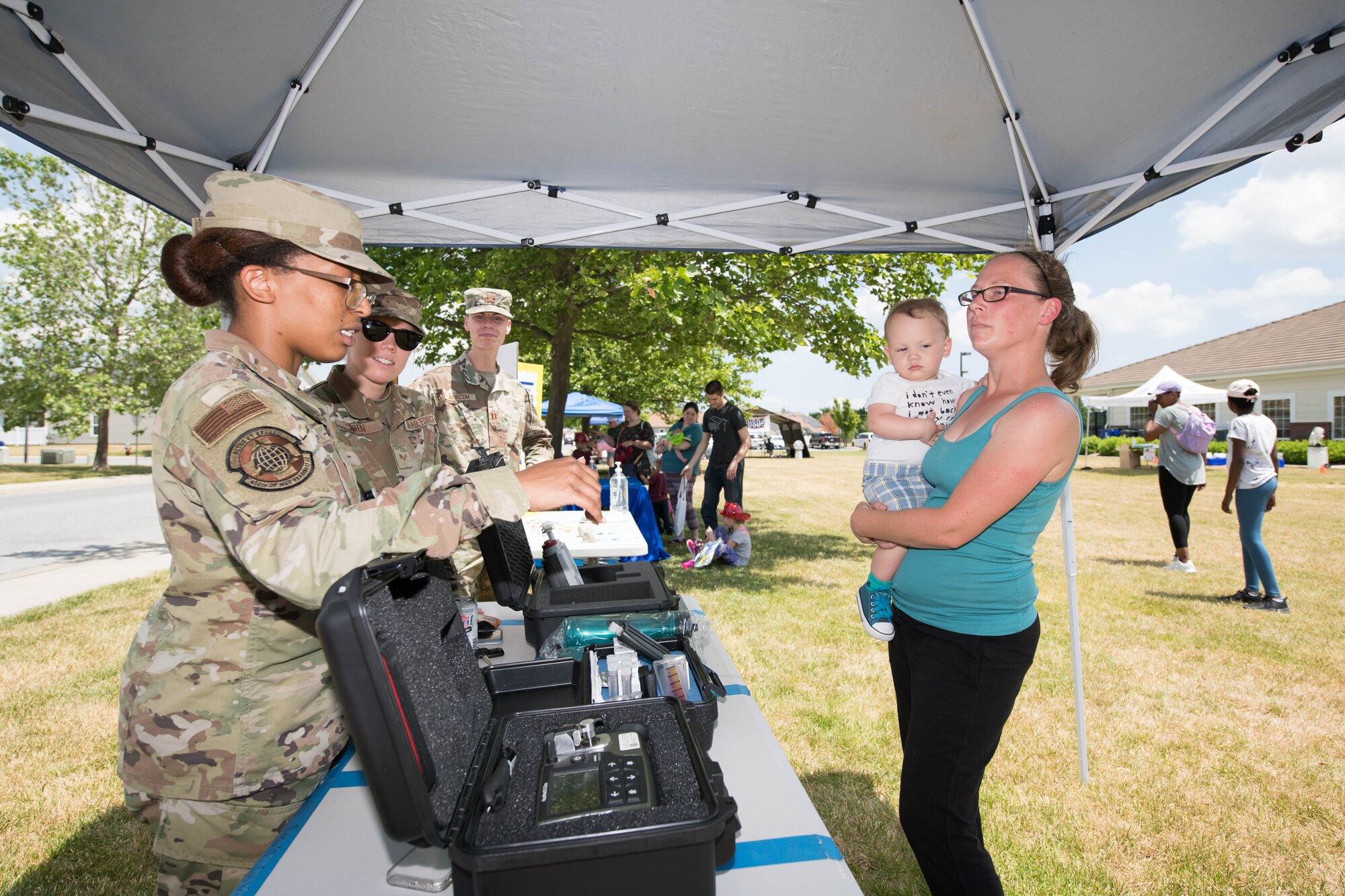 Airman 1st Class Victoria Abrahams, 436th Operational Medical Readiness Squadron bioenvironmental engineering apprentice, demonstrates water testing capabilities at the 2021 Hurricane Block Party at Dover Air Force Base, Delaware, May 27, 2021. The block party offered attendees useful information for before, during and after severe storms and hurricanes. (U.S. Air Force photo by Mauricio Campino)