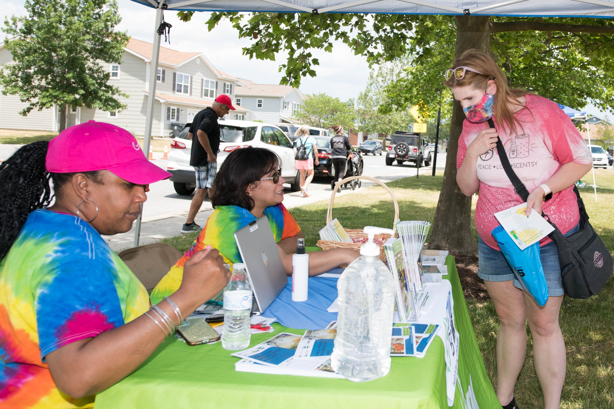 Melissa Gibbs, Supplemental Assistance 
Nutrition Program coordinator, and Melissa Campino, Stand By Me financial coach, both from the Food Bank of Delaware, hand out information pamphlets at the 2021 Hurricane Block Party at Dover Air Force Base, Delaware, May 27, 2021. Besides providing helpful emergency information, attendees also toured several booths set up by local organizations. (U.S. Air Force photo by Mauricio Campino)
