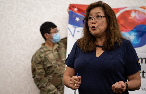 Kum Holl, Military Sealift Command liaison officer, speaks before Korean American Association of Scott Area scholarships were awarded to local high school students on Scott Air Force Base, Illinois, May 27, 2021. KAASA is a non-profit private organization that supports the local community through charity and educational outlets, and through donations they awarded $1,000 scholarships students to Danielle Chao, Alex Tillock, and Brady Martinez. (U.S. Air Force Photo by Airman 1st Class Isaac Olivera)