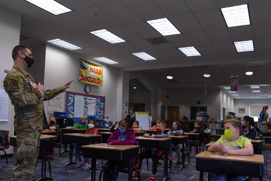 U.S. Air Force Capt. Adam Peck, 375th Air Mobility Wing chaplain, reads old stories from his family’s past at Scott Elementary School on Scott Air Force Base, Illinois, May 12, 2021. Peck was given the opportunity to read stories of his ancestor’s to the students, providing a glimpse into a lifestyle of the past. (U.S. Air Force photo by Airman 1st Class Mark Sulaica)