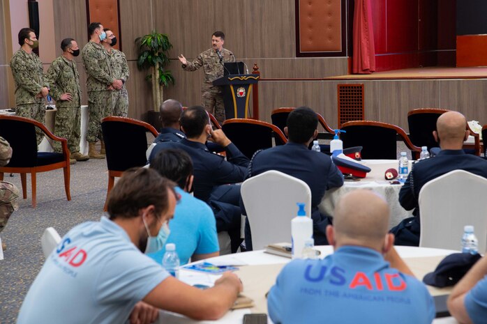 210525-N-IO414-1178 MANAMA, Bahrain (May 25, 2021) Personnel from the Bahrain Defense Force, U.S. Navy, U.S. Army, U.S. Embassy in Bahrain and U.S. Agency for International Development (USAID) Humanitarian Assistance Advisers watch a presentation about U.S. Army civil affairs capabilities during a Humanitarian Operations Workshop hosted by the Bahrain Ministry of Interior, and facilitated by U.S. Naval Forces Central Command (NAVCENT) and USAID in Manama, Bahrain, May 25. NAVCENT is the U.S. Navy element of U.S. Central Command in the U.S. 5th Fleet area of operations and encompasses about 2.5 million square miles of water area that includes the Arabian Gulf, Gulf of Oman, Red Sea and parts of the Indian Ocean. (U.S. Navy photo by Mass Communication Specialist 2nd Class Jordan Alexander Crouch)