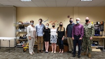 NSWC Crane interns stand with Crane leadership.