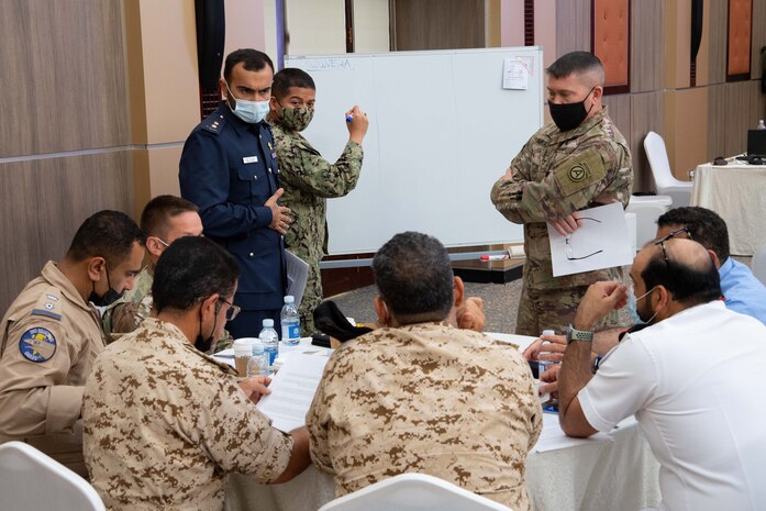 210525-N-IO414-1237 MANAMA, Bahrain (May 25, 2021) Personnel from the Bahrain Defense Force, U.S. Navy, U.S. Army, U.S. Embassy in Bahrain and U.S. Agency for International Development (USAID) Humanitarian Assistance Advisers discuss a case study during a Humanitarian Operations Workshop hosted by the Bahrain Ministry of Interior, and facilitated by U.S. Naval Forces Central Command (NAVCENT) and USAID in Manama, Bahrain, May 25. NAVCENT is the U.S. Navy element of U.S. Central Command in the U.S. 5th Fleet area of operations and encompasses about 2.5 million square miles of water area that includes the Arabian Gulf, Gulf of Oman, Red Sea and parts of the Indian Ocean. (U.S. Navy photo by Mass Communication Specialist 2nd Class Jordan Alexander Crouch)