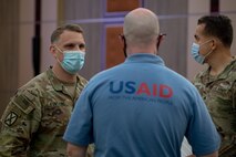210525-N-KZ419-1216 MANAMA, Bahrain (May 25, 2021) Staff Sgt. Mike Fontaine, left, assigned to Commander, Task Force 56, speaks with Chris Williams, a U.S. Agency for International Development (USAID) Humanitarian Assistance Adviser, about natural disaster response during a Humanitarian Operations Workshop hosted by the Bahrain Ministry of Interior, and facilitated by U.S. Naval Forces Central Command (NAVCENT) and USAID in Manama, Bahrain, May 25. CTF NAVCENT is the U.S. Navy element of U.S. Central Command in the U.S. 5th Fleet area of operations and encompasses about 2.5 million square miles of water area that includes the Arabian Gulf, Gulf of Oman, Red Sea and parts of the Indian Ocean. (U.S. Navy photo by Mass Communication Specialist 3rd Class Dawson Roth)
