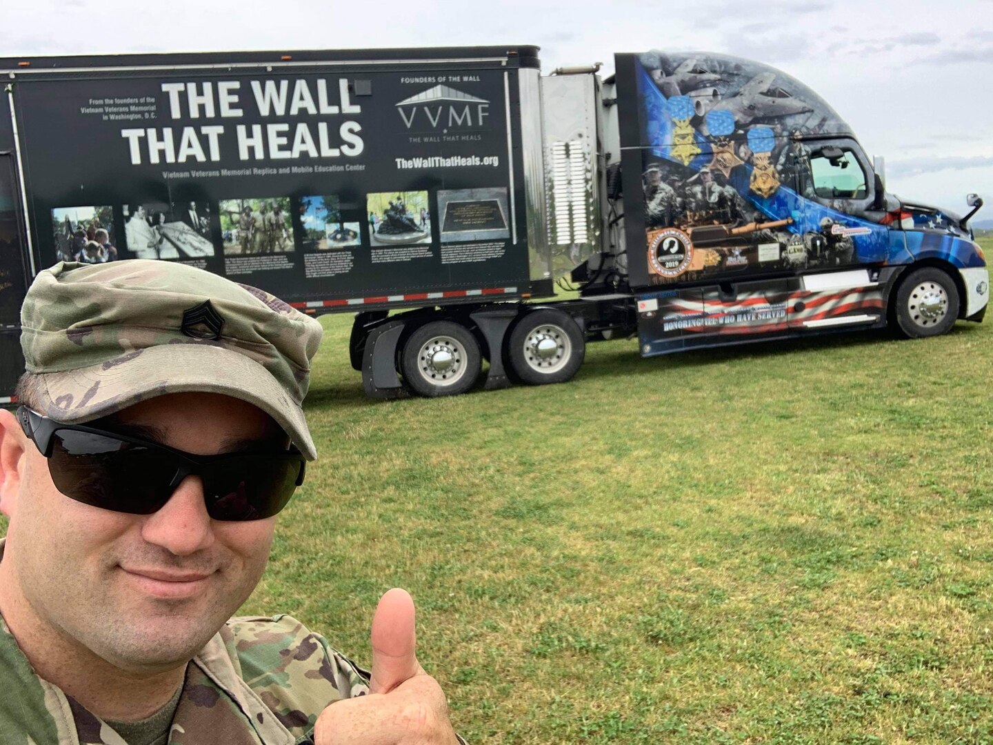Staff Sgt. Chris Dickenson, a recruiter for the Virginia Army National Guard, poses during the arrival of the Wall That Heals to Poplar Gap Park in Grundy, Virginia. The wall, which is a three quarters replica of the Vietnam Veterans Memorial in Washington, D.C., was displayed in the park May 6-9, 2021. (Courtesy photo)