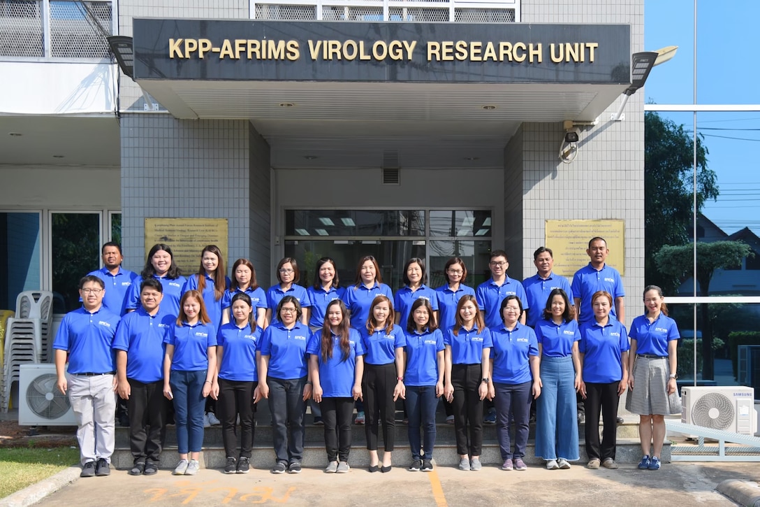 Kamphaeng Phet AFRIMS Virology Research Unit field station team members in front of their building.