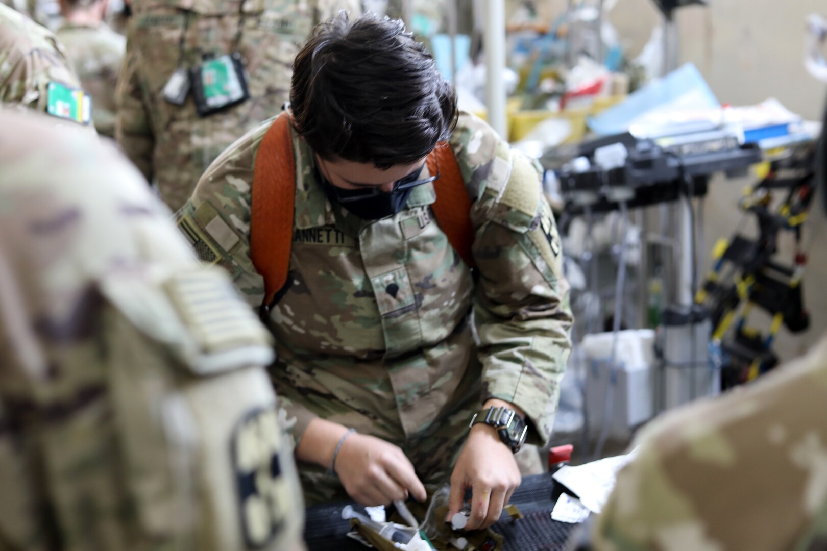 Spc. Olivia Mannetti, a combat medic with the 466th Medical Company, Area Support, New York National Guard, prepares to make an incision on a simulated throat as she practices conducting a cricothyrotomy at the Role 2 compound at Ain al-Asad base, Iraq, Oct. 30, 2020. The company recently completed a nine-month deployment to the Middle East and returned to New York.