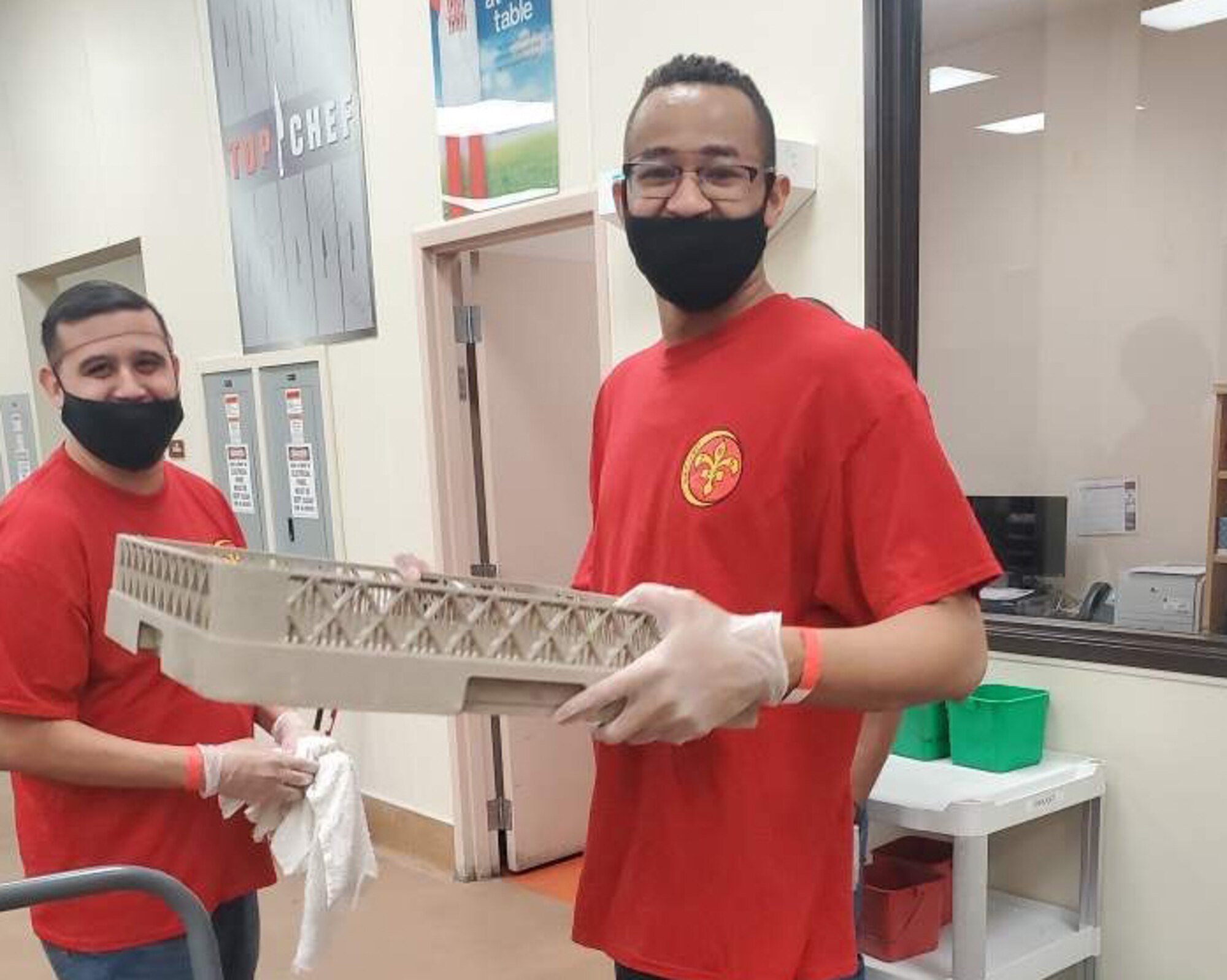 Master Sgt. Enrique Dejesus-Roigand and Staff Sgt. Ivan Candley, 706th Fighter Squadron, volunteer at a local nonprofit food organization May 27, in Las Vegas, Nevada.