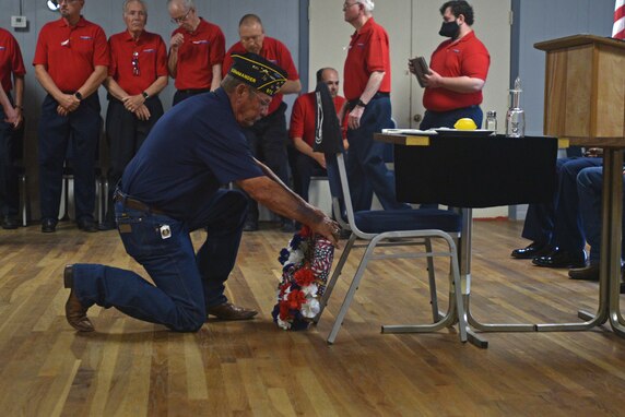 A member of the American Legion presents a wreath during the Memorial Day ceremony at the Veterans of Foreign Wars Post 1815 in San Angelo, Texas, May 31, 2021. Various organizations laid wreaths to honor fallen service members. (U.S. Air Force by Senior Airman Ashley Thrash)