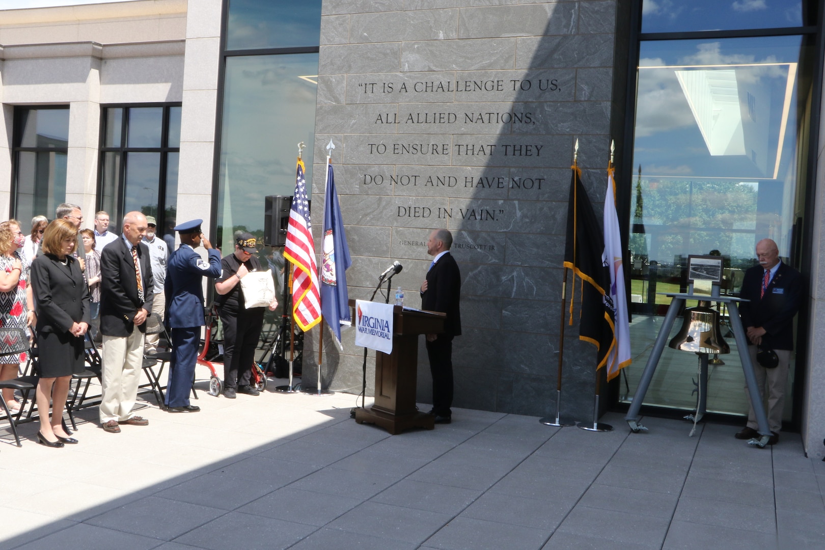 Attendees at the 2021 Commonwealth’s Memorial Day Ceremony pay tribute to fallen service members during the playing of taps May 31, 2021, at the Virginia War Memorial in Richmond, Virginia.