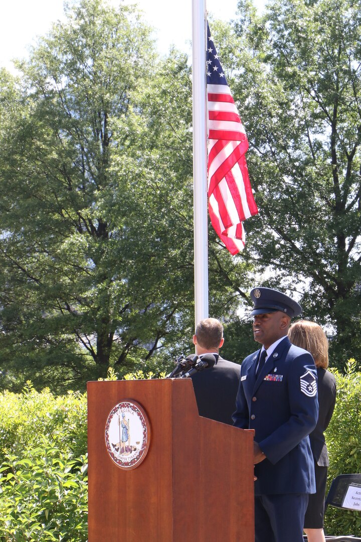 Virginia Air National Guard Master Sgt. Damon L. Obasi sings the national anthem during the 2021 Commonwealth’s Memorial Day Ceremony May 31, 2021, at the Virginia War Memorial in Richmond, Virginia.