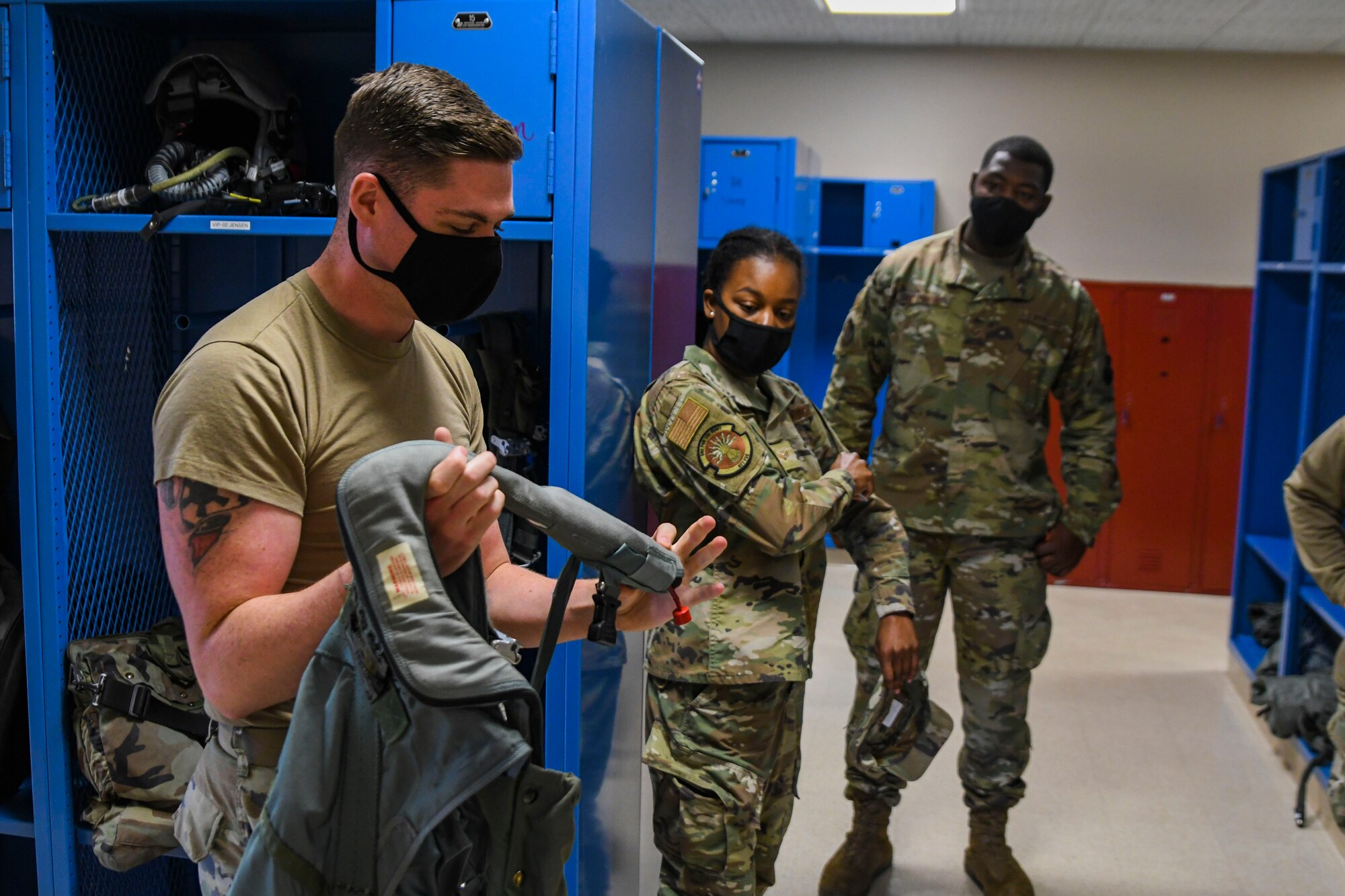 A photo of an airmen holding a harness