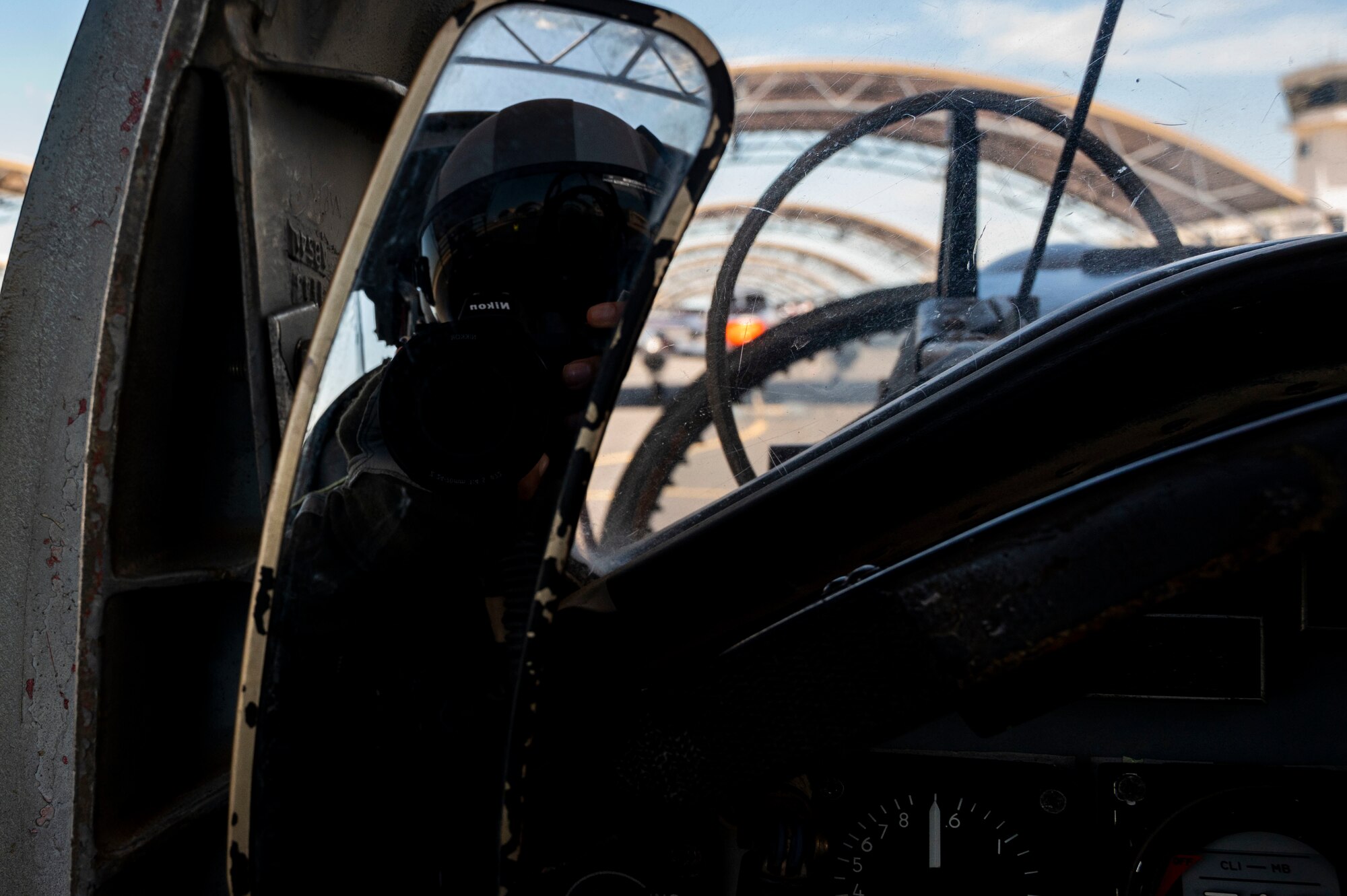 Airman 1st Class David Phaff sits waiting for take off to begin and capture photos and video of aircraft as they fly in several formations on May 2, 2021 at Corpus Christi, Texas. An aerial photography mission is to capture content while flying with pilots to help document the Air Force mission. (U.S. Air Force photo by Airman 1st Class David Phaff)