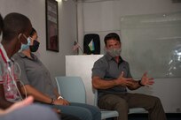 U.S. Army Master Sgt. Mike Maglio, a team sergeant with Civil Affairs East Africa (CA-EA), a forward deployed element of Southern European Task Force - Africa (SETAF-AF) and Combined Joint Task Force – Horn of Africa (CJTF-HOA), participates in an English discussion group at the American Corner, Djibouti, May 25, 2021. The soldiers conduct intermediate and advanced courses at the American Corner, helping students practice their new English language skills with native speakers.