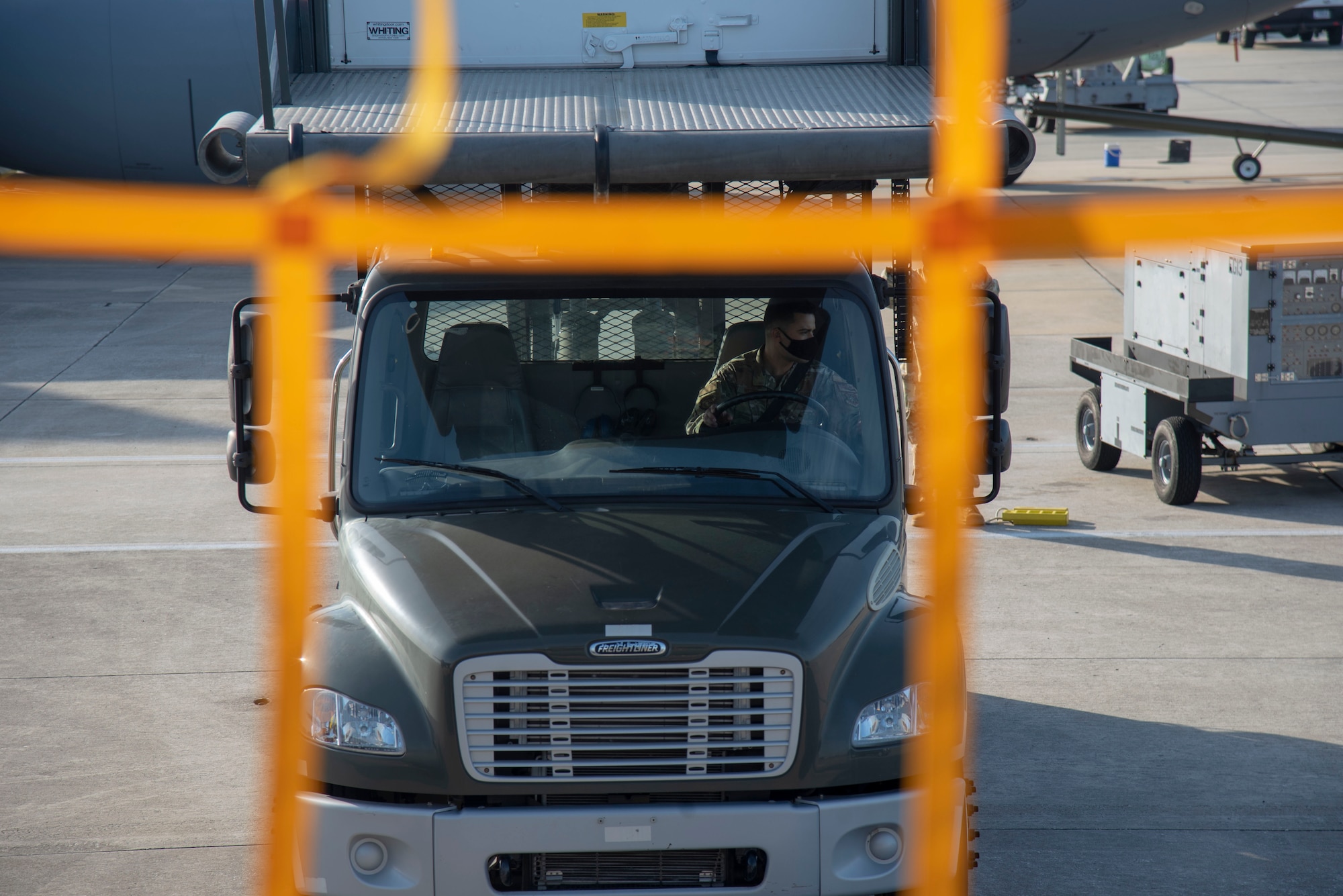 U.S. Air Force Staff Sgt. Gavin Weidel, 6th Operations Support Squadron (OSS) Aircrew Flight Equipment (AFE) Technician, reverses a truck on the flightline at MacDill Air Force Base, Florida, April 14, 2021. MacDill is home to 24 KC-135 stratotanker aircraft, which all require safety equipment that is maintained and distributed by the 6th OSS AFE team.