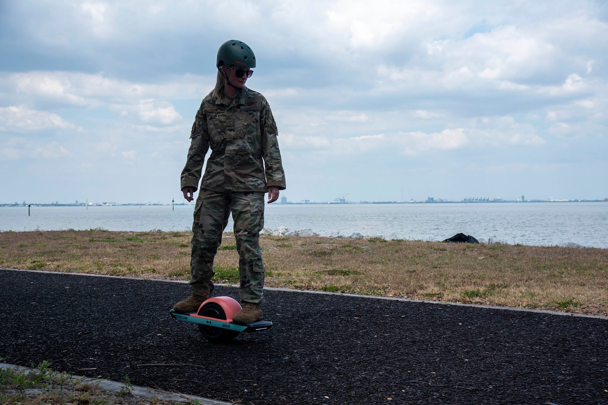 U.S. Air Force Tech. Sgt. Shawna Wise, 6th Force Support Squadron Airman Leadership School lead instructor, rides a self-balancing single wheel electric board at MacDill Air Force Base, Florida, May 26, 2021.  Wise enjoys physically active hobbies such as her electric skateboard, running, hiking and going to the beach.