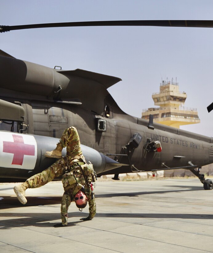 Staff Sgt. Brianna Pritchard, an Army National Guard UH-60 Black Hawk helicopter mechanic from Anchorage, Alaska, shows her Olympic breaking moves at Al Asad Air Base, Iraq.