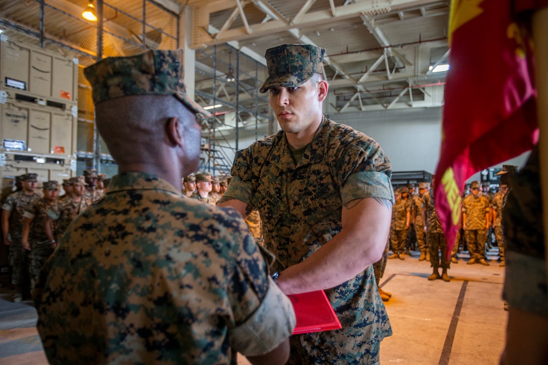 U.S. Marine Corps Sgt. Kaleb Smith, an automotive maintenance technician with Combat Logistics Battalion 31, 31st Marine Expeditionary Unit (MEU), and a native of Knoxville, Tennessee, is awarded the 2020 Motor Transport Noncommissioned Officer of the Year at Camp Hansen, Okinawa, Japan, on May 28, 2021.