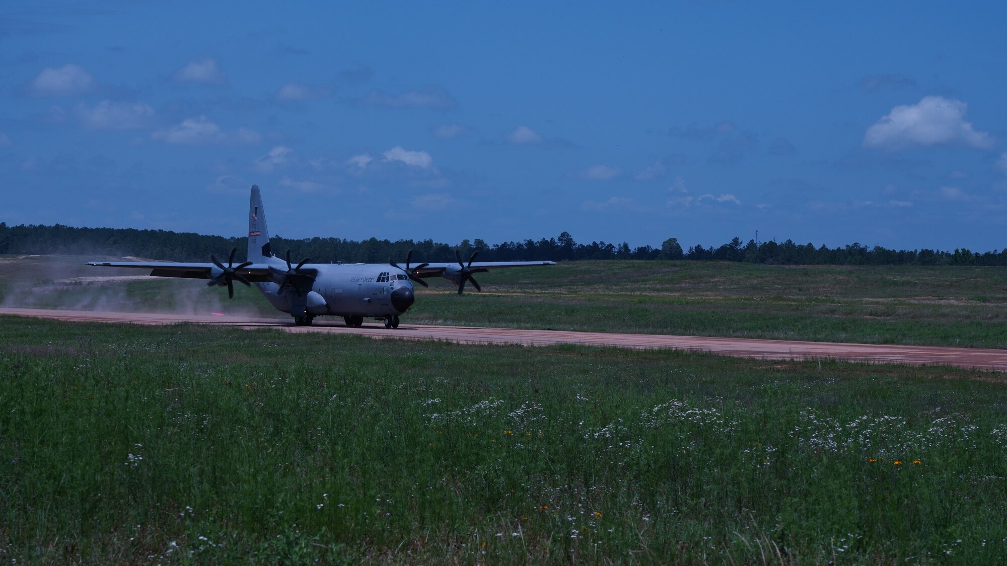 The 815th Airlift Squadron provided airlift and airdrop support during Voyager Shield, an exercise hosted by the 621st Air Mobility Advisory Group at the Joint Readiness Training Center and Fort Polk, La., May 25-27. This exercise provided the 815th AS required tactical training for the pilots and loadmasters. Pilots trained on communicating with landing and drop zone controllers, semi-prepared runway operations, and assault landings. Loadmaster specific training included rolling stock loading/unloading in both normal and engine running operations, patient loading with engines running and personnel drops. (U.S. Air Force photo by Jessica L. Kendziorek)