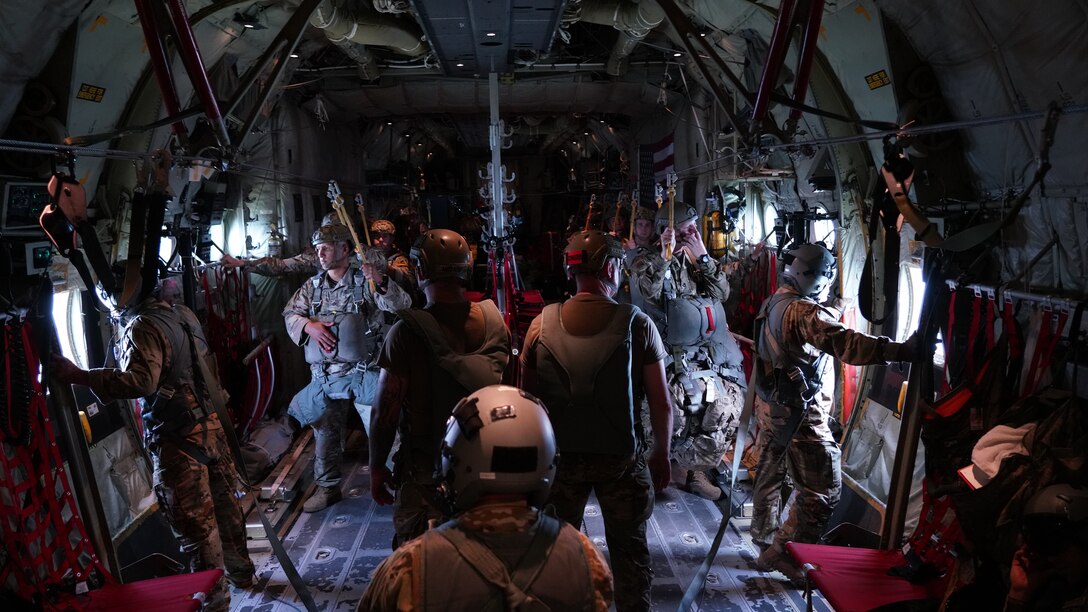 Joint Readiness Training Center Operation Group Airborne parachutists standby for their static line jump from a C-130J Super Hercules May 27, 2021. The 815th Airlift Squadron, known as the “Flying Jennies,” provided airlift and airdrop support during Voyager Shield, an exercise hosted by the 621st Air Mobility Advisory Group at the Joint Readiness Training Center and Fort Polk, La., May 25-27.