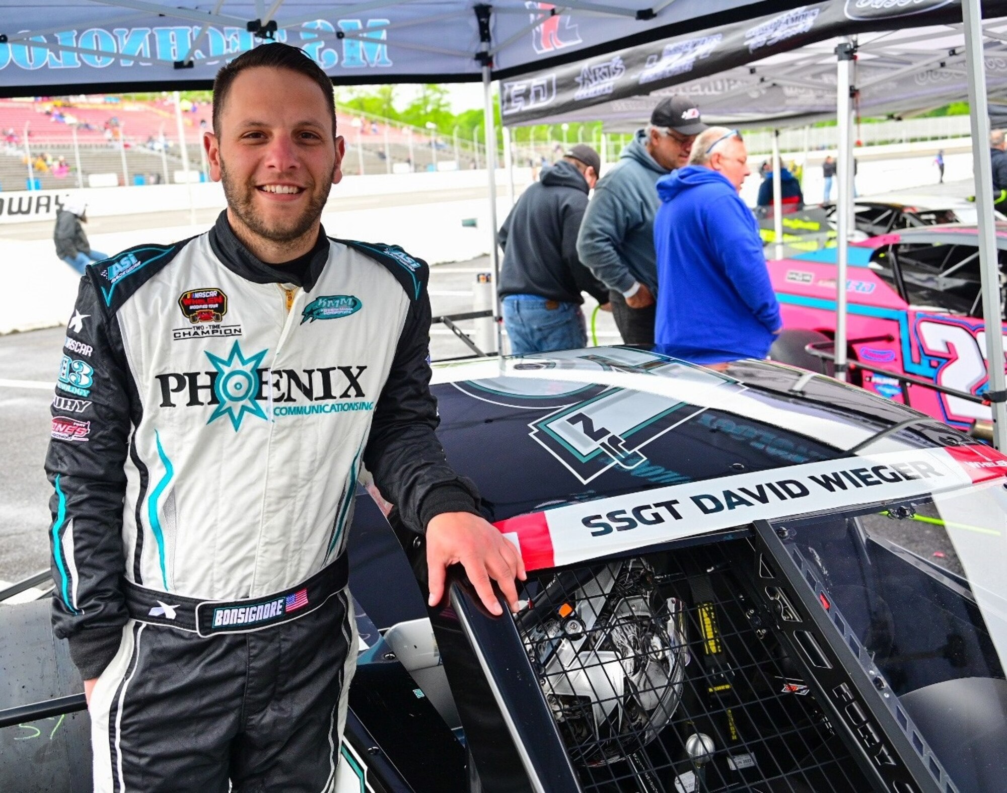 Justin Bonsignore, two-time Whelen Modified Tour champion, shows the name of  Staff Sgt. David Wieger, a fallen Office of Special Investigations special agent, on his Kenneth Massa Motorsports car, prior to his victory in the Jennerstown Salutes 150 race in Jennerstown, Pa., May 29, 2021. Bonsignore and 33 fellow drivers honored the memory of Fallen Heroes during the Memorial Day weekend event at the Jennerstown Speedway.