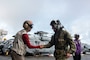 Capt. Matthew Ventimiglia greets Vice Adm. Bill Merz, commander, U.S. 7th Fleet, on the flight deck for a ship visit.