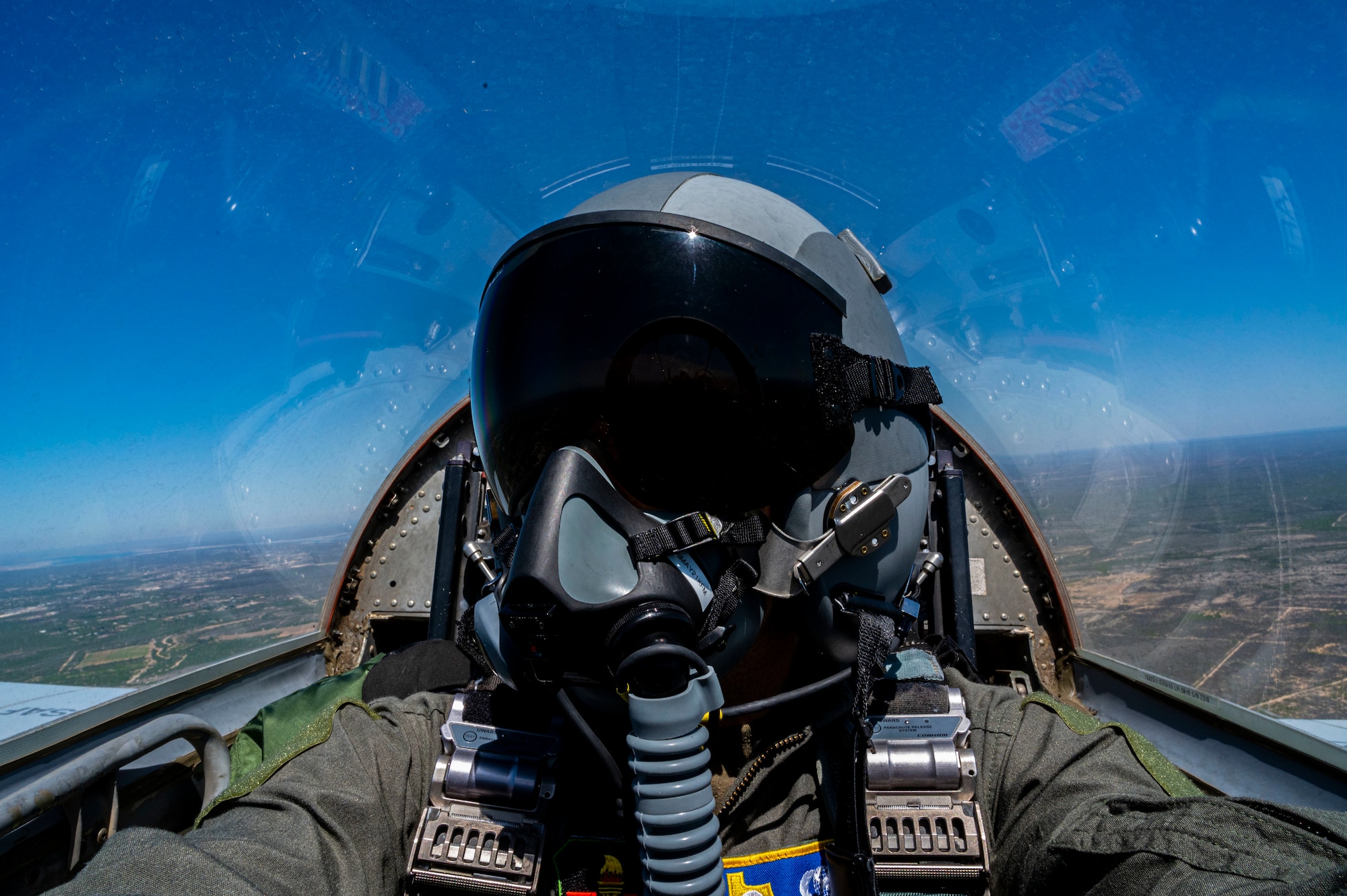 Airman 1st Class David Phaff sits waiting for take off to begin and capture photos and video of aircraft as they fly in several formations. An aerial photography mission is to capture content while flying with pilots to help document the Air Force mission. (U.S. Air Force photo by Airman 1st Class David Phaff)