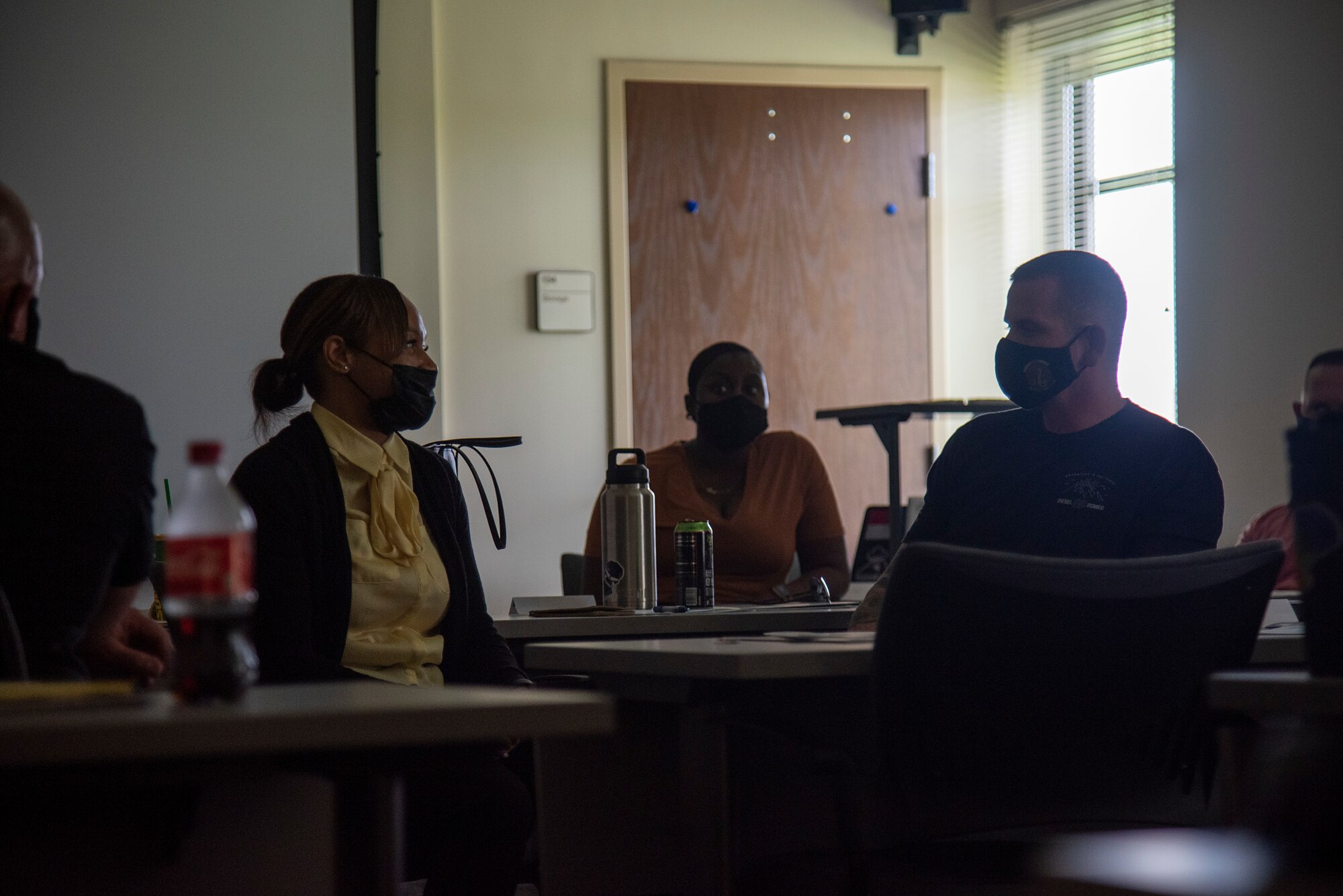 Two service members discuss a suicide intervention scenario during an Applied Suicide Intervention Skills Training (ASIST) course, led by Air Force Wounded Warrior Program (AFW2) leaders, at MacDill Air Force Base, Florida, May 12, 2021. 6th Air Refueling Wing first sergeants reached out to AFW2 to lead ASIST which is a suicide prevention and intervention program designed to teach participants life-assisting intervention skills from a community-based approach.
