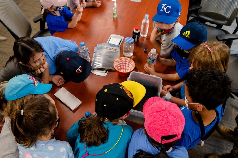 A group of first grade students from Osan Elementary School, observe a weather front demonstration at Osan Air Base, Republic of Korea, May 26, 2021. The 51st Operations Support Squadron Weather Flight hosted a field trip to teach students about meteorology and the science of weather. (U.S. Air Force photo by Tech. Sgt. Nicholas Alder)