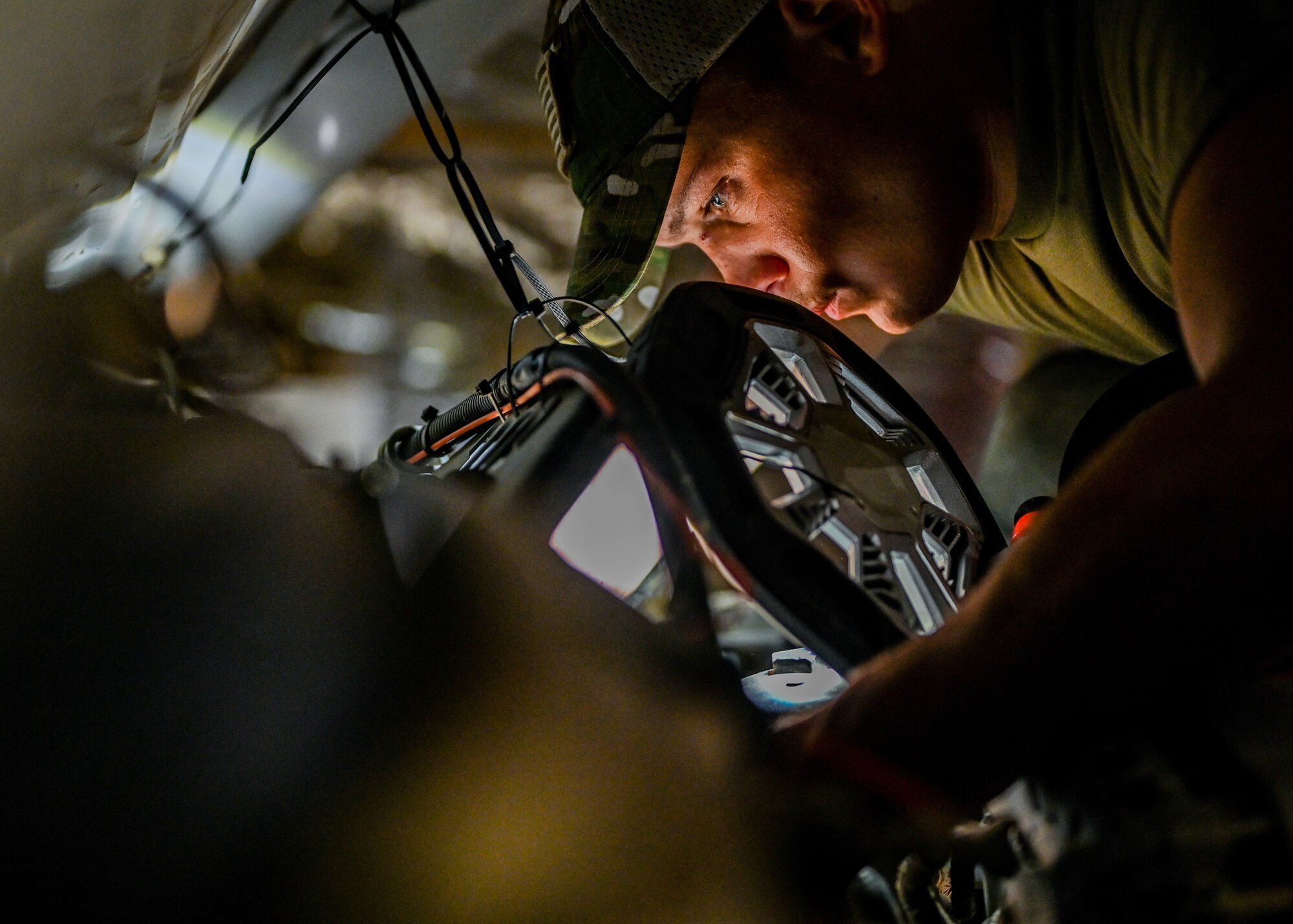Senior Airman Ryan Knutson, 726th Expeditionary Air Base Squadron vehicle maintenance technician, works on an ambulance for the 776 Expeditionary Air Base Squadron fire department at Chabelley Airfield, Djibouti, May 25, 2021. Knutson has worked on over 50 vehicles during his deployment. (U.S. Air Force photo by Airman 1st Class Jan K. Valle)