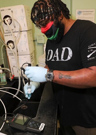 Environmental Protection Specialist (Code 106.323) Kenneth Clarke performs his job onboard Norfolk Naval Shipyard.