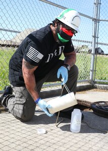 Environmental Protection Specialist (Code 106.323) Kenneth Clarke performs his job onboard Norfolk Naval Shipyard.