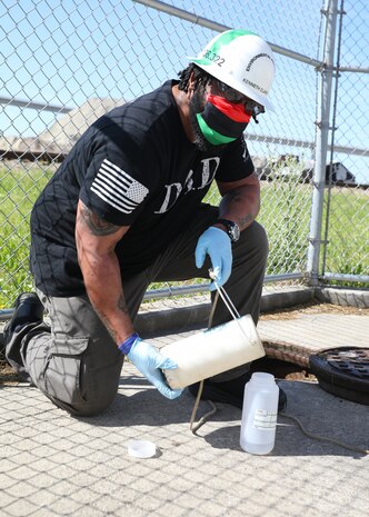 Environmental Protection Specialist (Code 106.323) Kenneth Clarke performs his job onboard Norfolk Naval Shipyard.