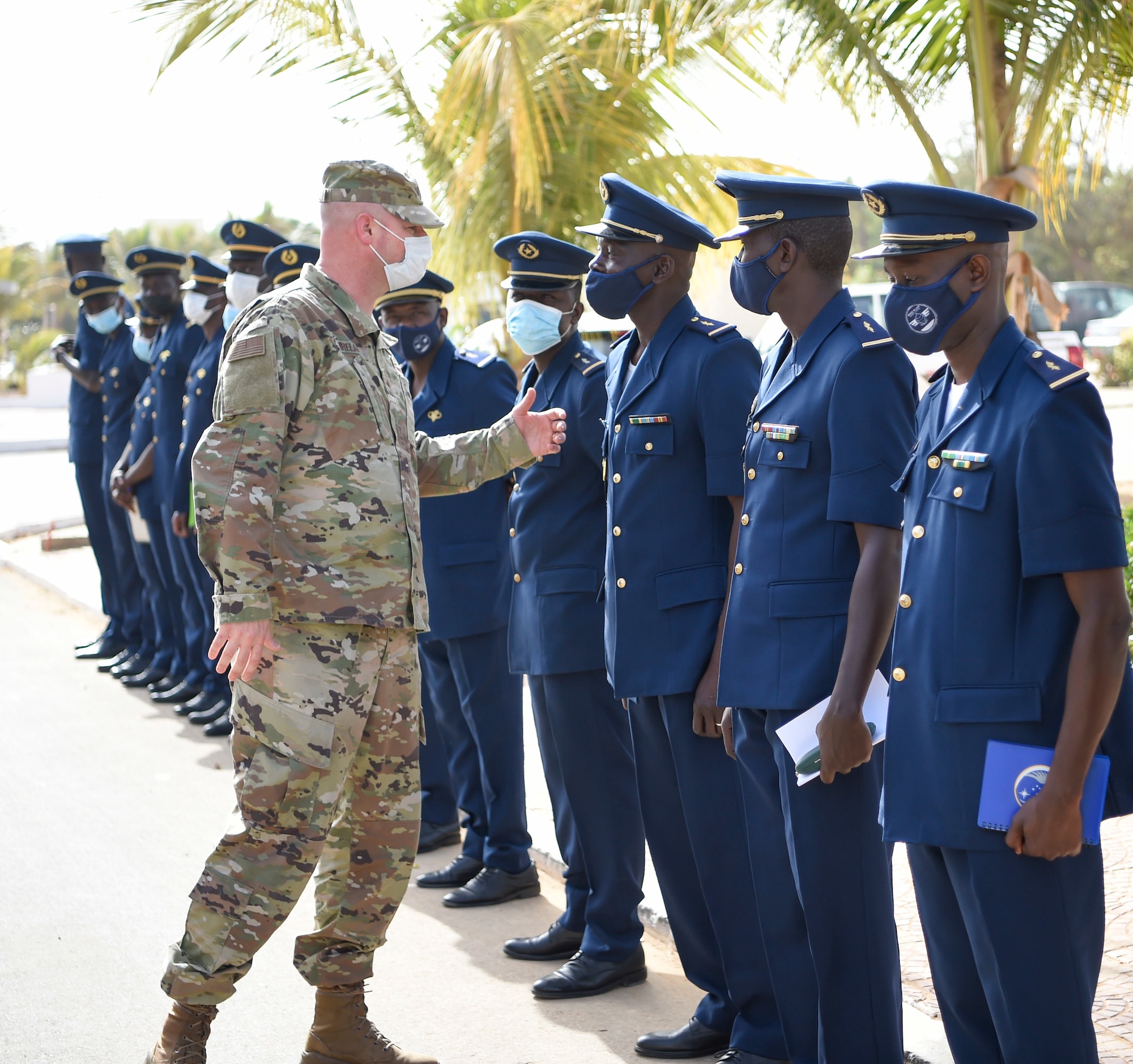 Brig. Gen. Christopher Ireland, U.S. Air Forces in Europe-Air Forces Africa chief of staff, greets Senegalese air force members in Thies, Senegal, May 26, 2021. Ireland led a team of seven Airmen to Senegal for a week-long force development engagement. (U.S. Air Force photo by 1st Lt. Hannah Durbin)
