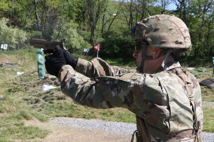 Sgt. Samuel Johnson engages targets on the pistol qualification range May 12, 2021, during the Region II Best Warrior Competition at Fort Indiantown Gap, Pennsylvania.