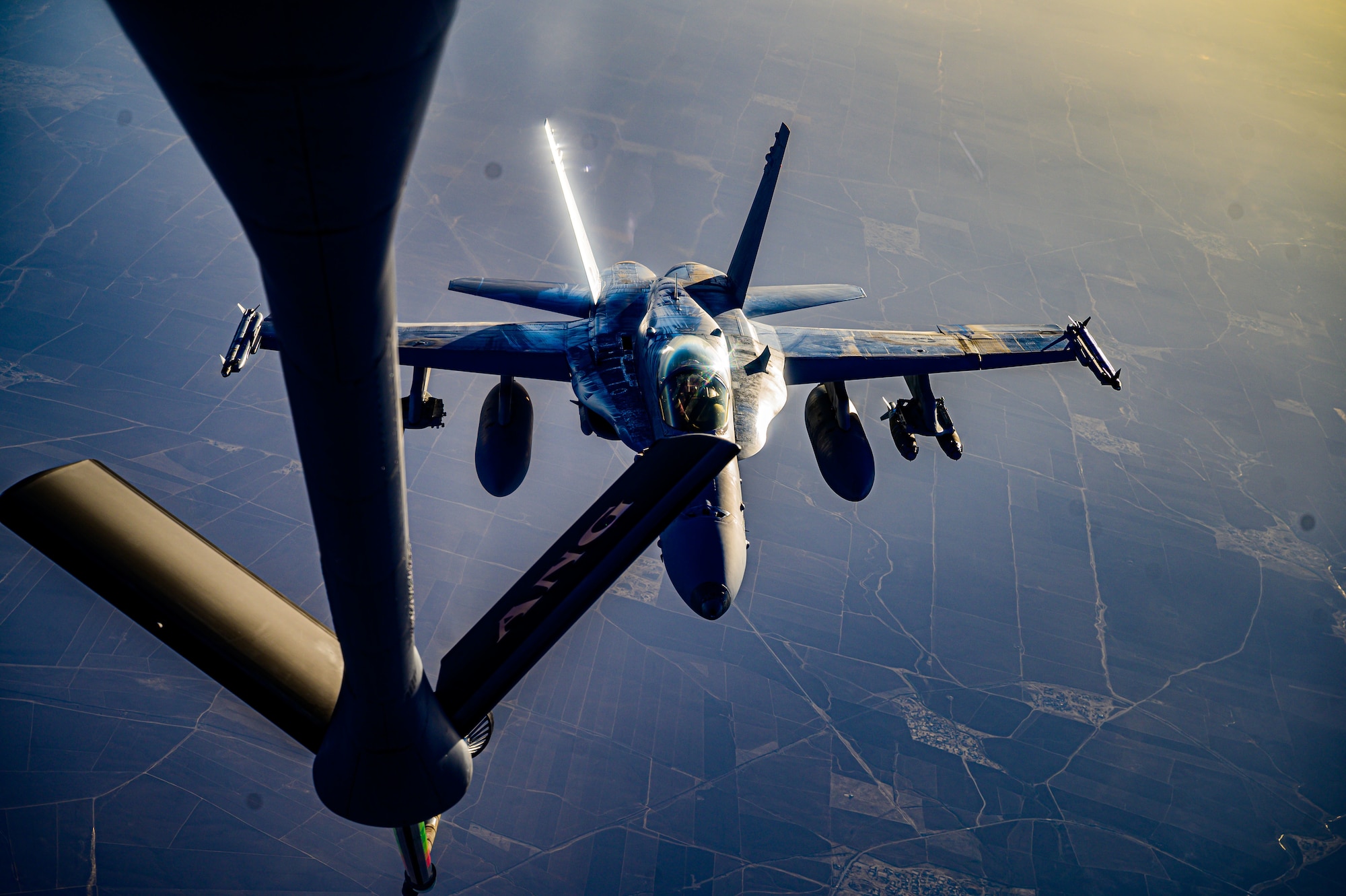 A U.S. Marine Corps F/A-18D Hornet aircraft from Marine All Weather Attack Squadron 224, Marine Aircraft Group 31, approaches the refueling boom of a U.S. Air Force KC-135 Stratotanker aircraft during a mission supporting a dynamic force employment over the U.S. Central Command area of responsibility, May 18, 2021. Dynamic operations and force employment in the theater highlight the U.S. military’s ability to deploy and employ forces anywhere around the globe. (U.S. Air Force photo by Tech. Sgt. Robert Harnden)
