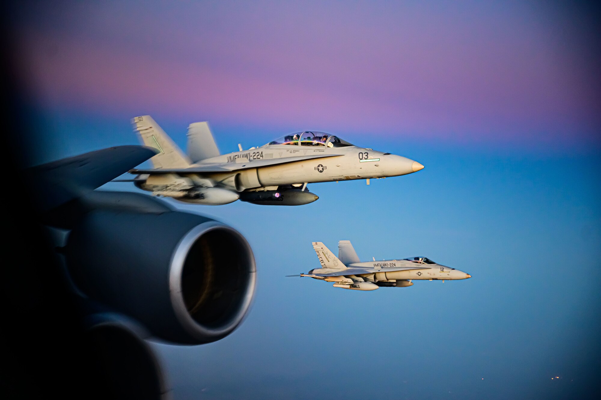 Two U.S. Marine Corp F/A-18D Hornet aircraft fly alongside a U.S. Air Force KC-135 Stratotanker aircraft during a mission supporting a dynamic force employment, May 18, 2021. Dynamic operations and force employment in the theater highlight the U.S. military’s ability to deploy and employ forces anywhere around the globe. (U.S. Air Force photo by Tech. Sgt. Robert Harnden)