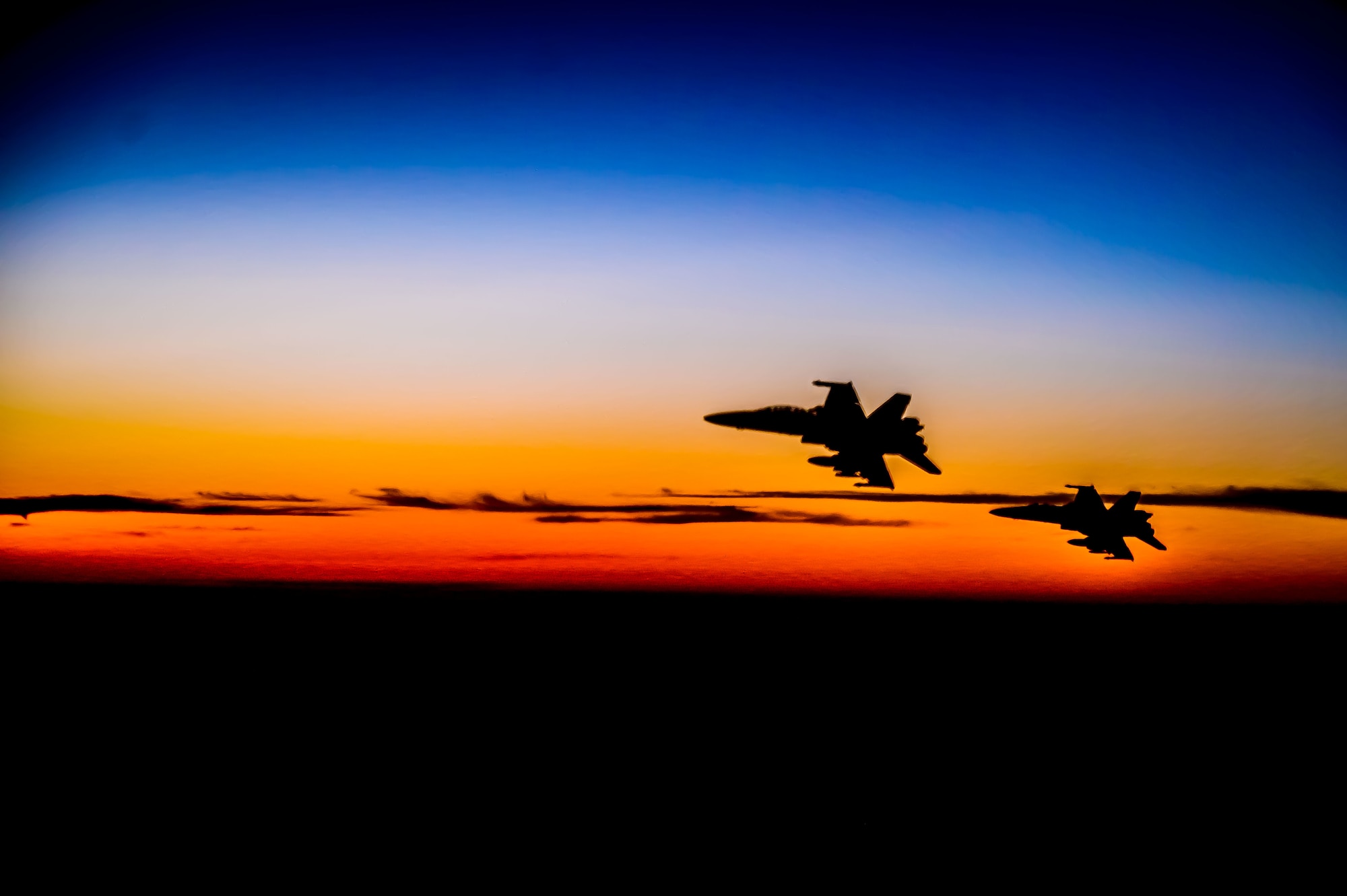 Two U.S. Marine Corps F/A-18D Hornet aircraft fly alongside a U.S. Air Force KC-135 Stratotanker aircraft during a mission supporting a dynamic force employment, May 18, 2021. Dynamic operations and force employment in the theater highlight the U.S. military’s ability to deploy and employ forces anywhere around the globe. (U.S. Air Force photo by Tech. Sgt. Robert Harnden)