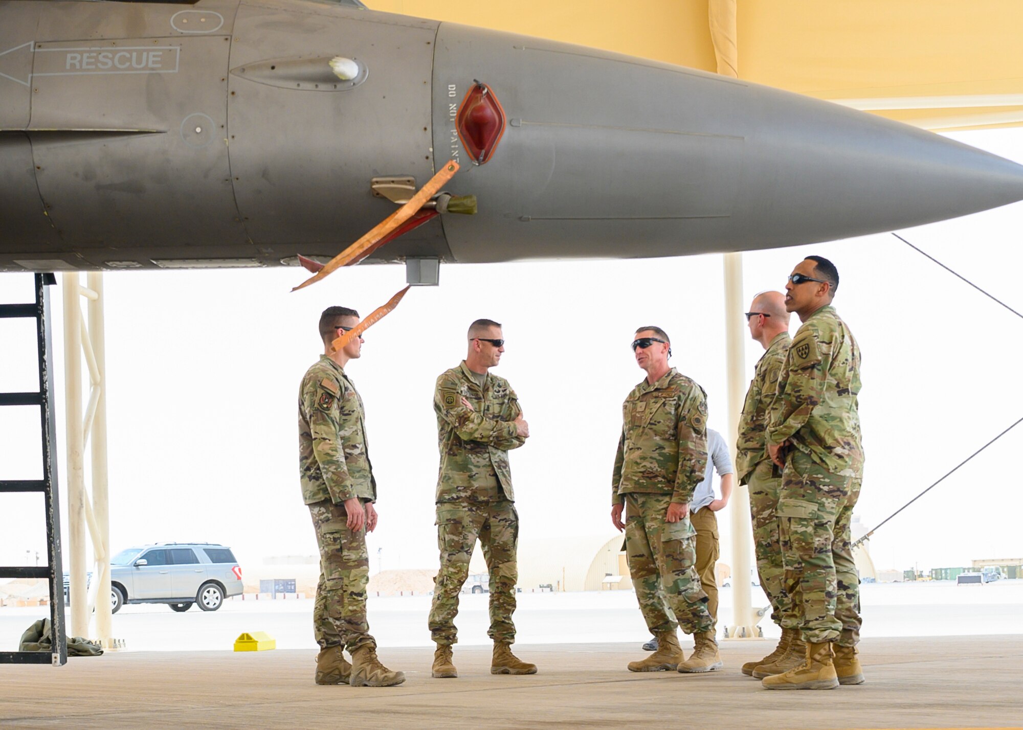 Brig. Gen. Evan Pettus, 378th Air Expeditionary Wing commander, briefs members of a senior leader visit about the U.S. Air Force F-16CJ Fighting Falcons stationed at Prince Sultan Air Base, Kingdom of Saudi Arabia, May 26, 2021. Several U.S. generals from across the region and their staff visited units at PSAB, meeting with various personnel to learn about defense efforts and expanding capabilities on base. (U.S. Air Force photo by Senior Airman Samuel Earick)