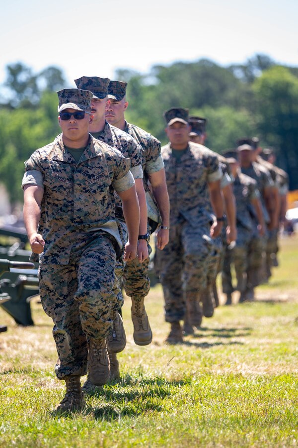 U.S. Marines with 2nd Battalion, 10th Marine Regiment, 2d Marine Division, march into position during a salute of 21-Minute Guns on Camp Lejeune, N.C., May 31, 2021.