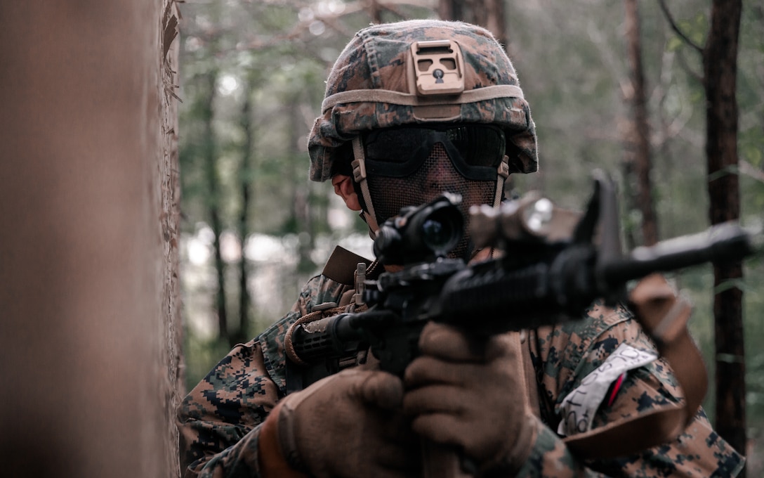U.S. Marine Corps Lance Cpl. Ethan Sheffey, a Withe County, Va. native and mortarman with 3rd Battalion, 2d Marine Regiment (3/2), 2d Marine Division, scans the area during a raid as part of Exercise Raven in Nashville, Tenn., May 29, 2021. Exercise Raven is an integrated training exercise with Marines from 3/2 and Marine Corps Forces Special Operations Command simulating real-life tactical scenarios to enhance overall unit interoperability, effectiveness and lethality against an adversarial force. (U.S. Marine Corps photo by Cpl. Patrick King)