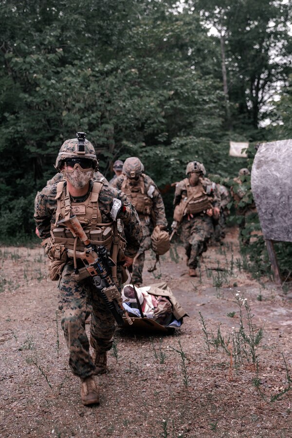 U.S. Marines with 3rd Battalion, 2d Marine Regiment (3/2), 2d Marine Division, evacuate a simulated casualty during a raid while participating in Exercise Raven in Nashville, Tenn., May 29, 2021.
