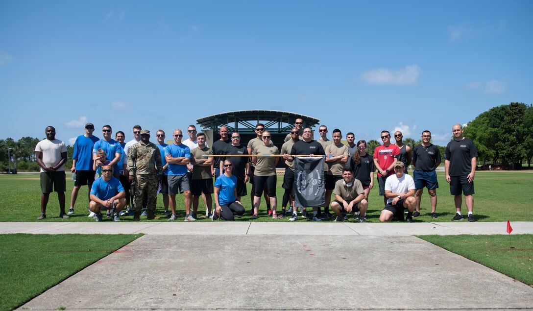 Airmen pose for a photo.