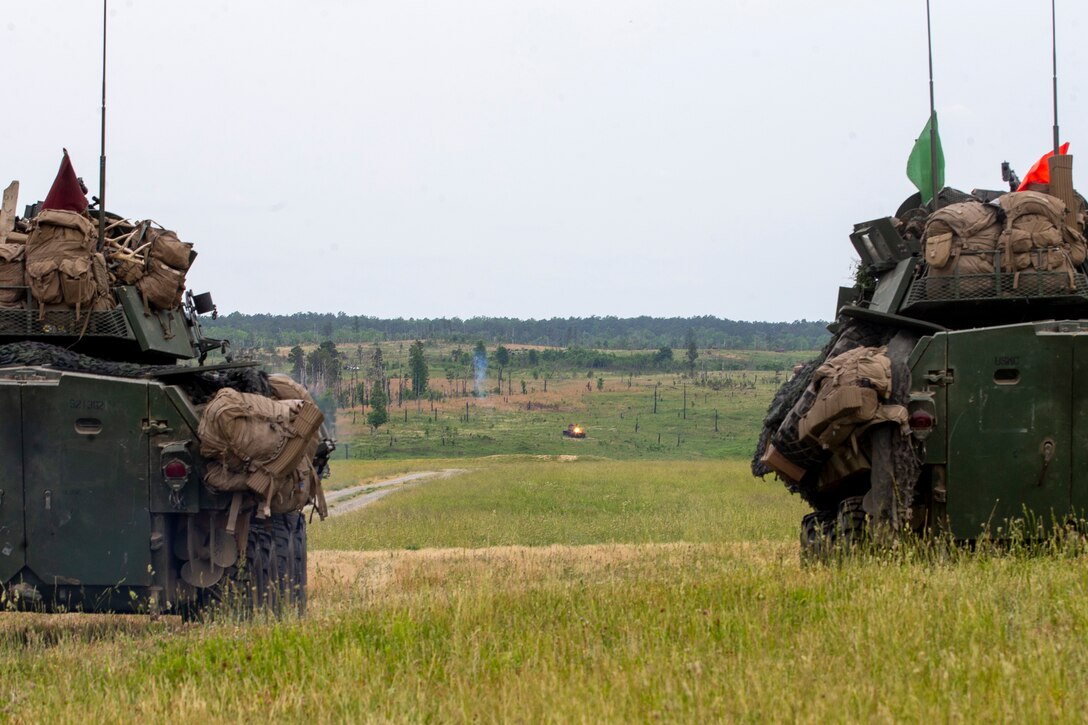U.S. Marines with 2d Light Armored Reconnaissance Battalion, 2d Marine Division, fire at targets with light armored vehicles during a Marine Corps Combat Readiness Evaluation (MCCRE) at Fort Pickett, Va., May 23, 2021. A MCCRE is an exercise designed to formally evaluate a unit's combat readiness and if successful, the unit will achieve apex status and is deemed ready for global employment. (U.S. Marine Corps photo by Pfc. Sarah Pysher)