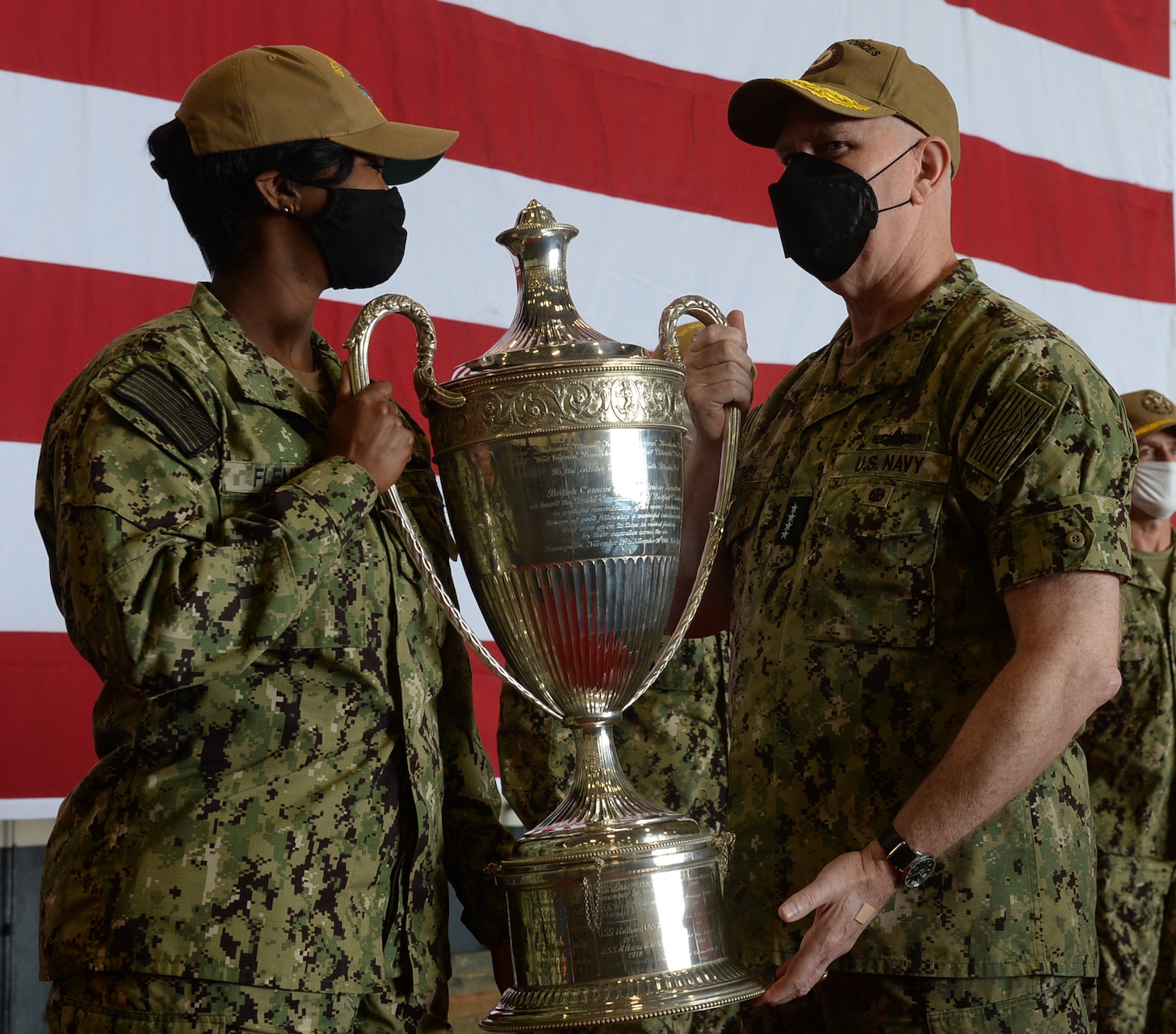 The Nimitz-class aircraft carrier USS Harry S. Truman's (CVN 75) Sailor of the Year, Retail Services Specialist 1st Class Kimberly Fleming, from Harlem, New York, receives the 2020 Battenberg Cup from Adm. Christopher Grady, commander, U.S. Fleet Forces Command, on behalf of the crew of USS Harry S. Truman.