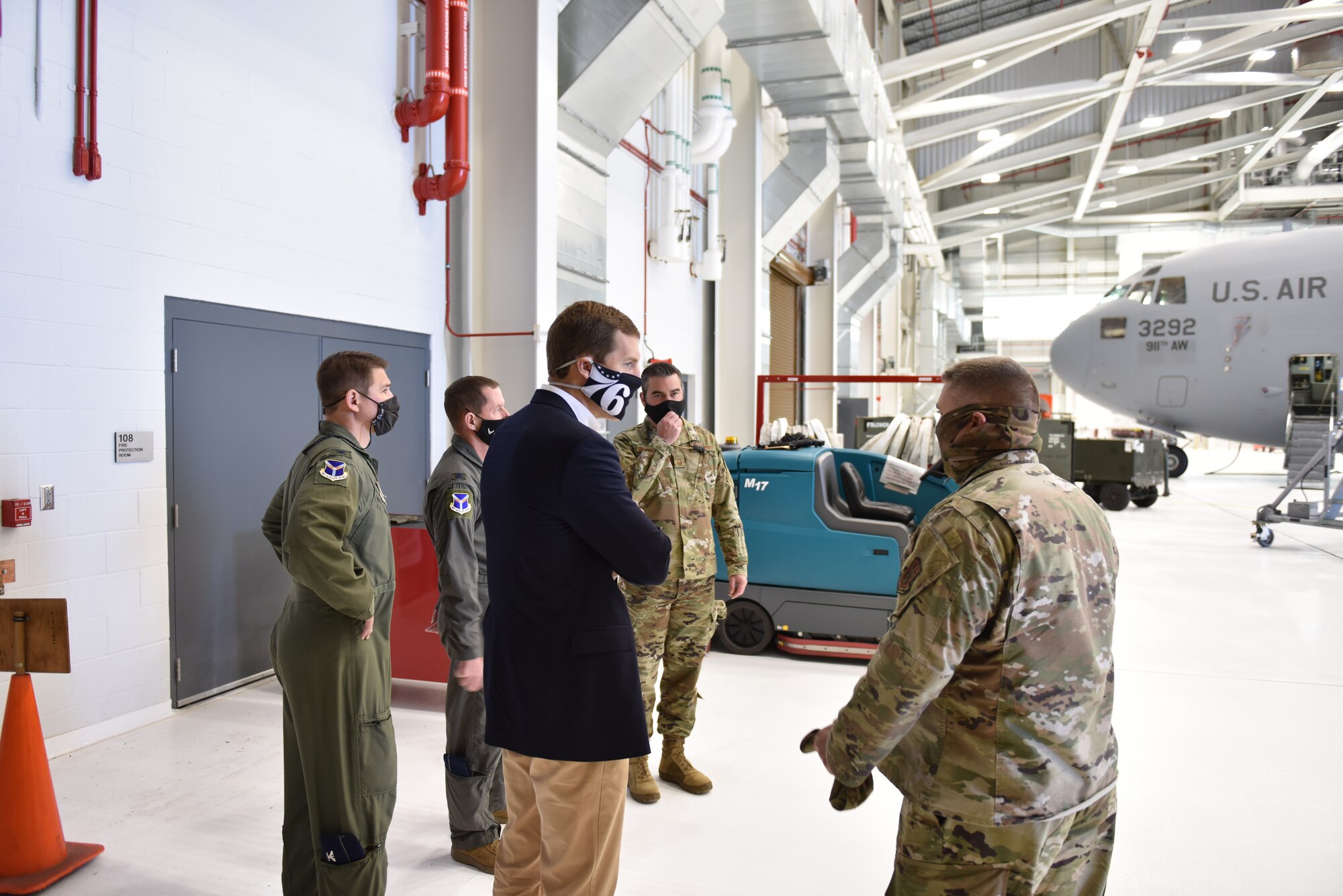 Air Force Maj. Joe Walters, 911th Aircraft Maintenance Squadron commander (right), briefs U.S State Rep. Conor Lamb, Pennsylvania's 17th district, regarding the capabilities of the Airmen assigned to the C-17 Globemaster III maintenance squadron, the duties they perform, and how the squadron performs their mission inside the newest two-bay hangar at the Pittsburgh International Airport Air Reserve Station, April 26, 2021.